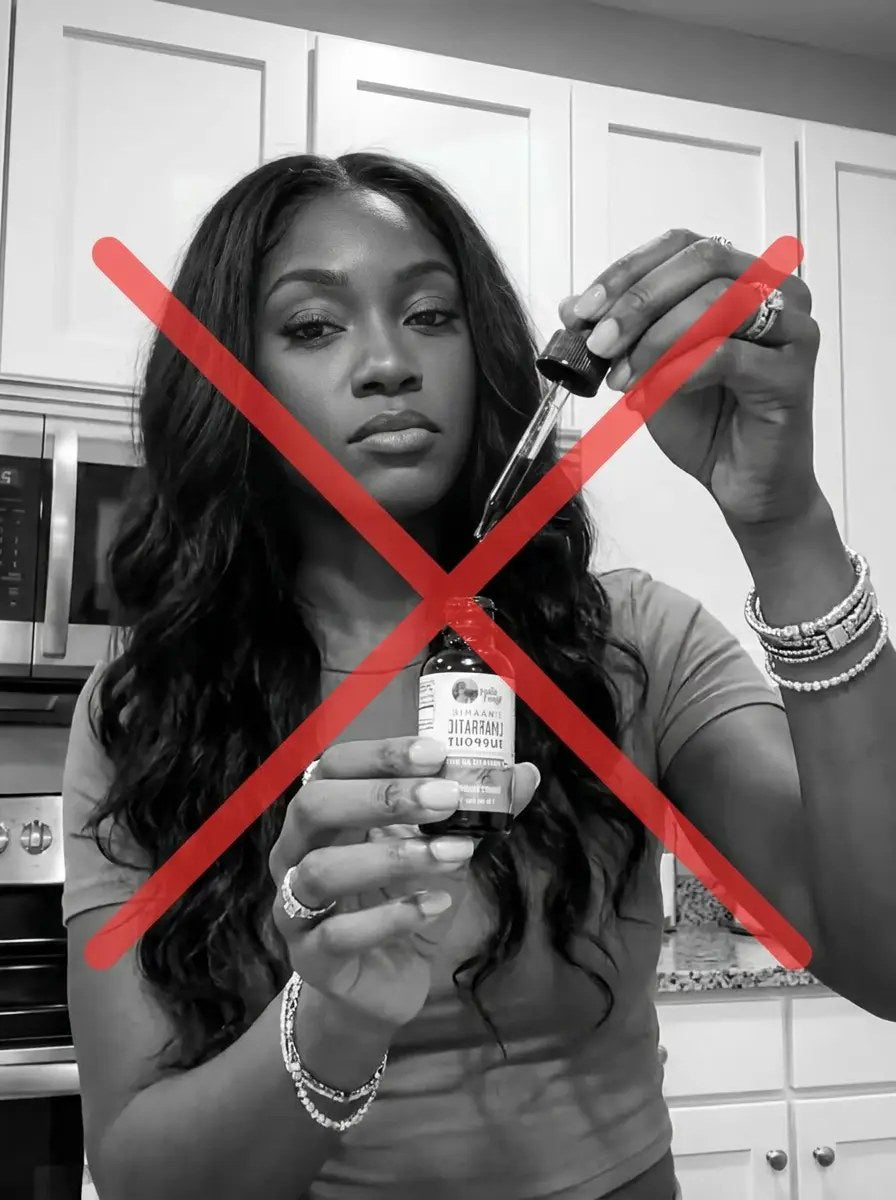 Woman holding a lymphatic drops bottle, crossed out in red — viral TikTok drops did not work