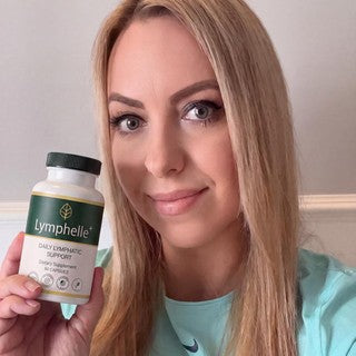 Margaret Ellison holding a bottle of Lymphelle+